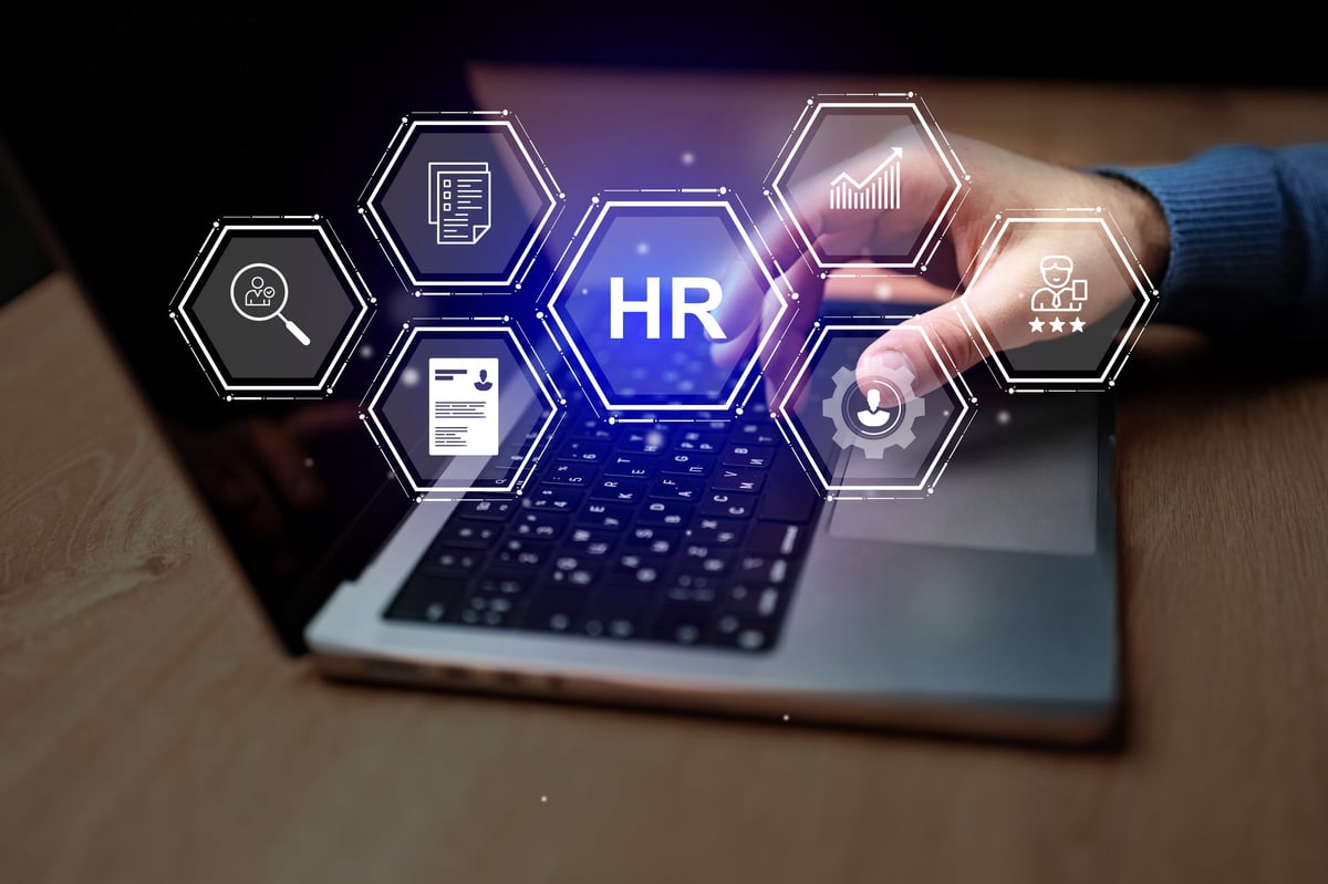 Professional working with human resources management concepts, centralising employee skills and workforce data in a modern office