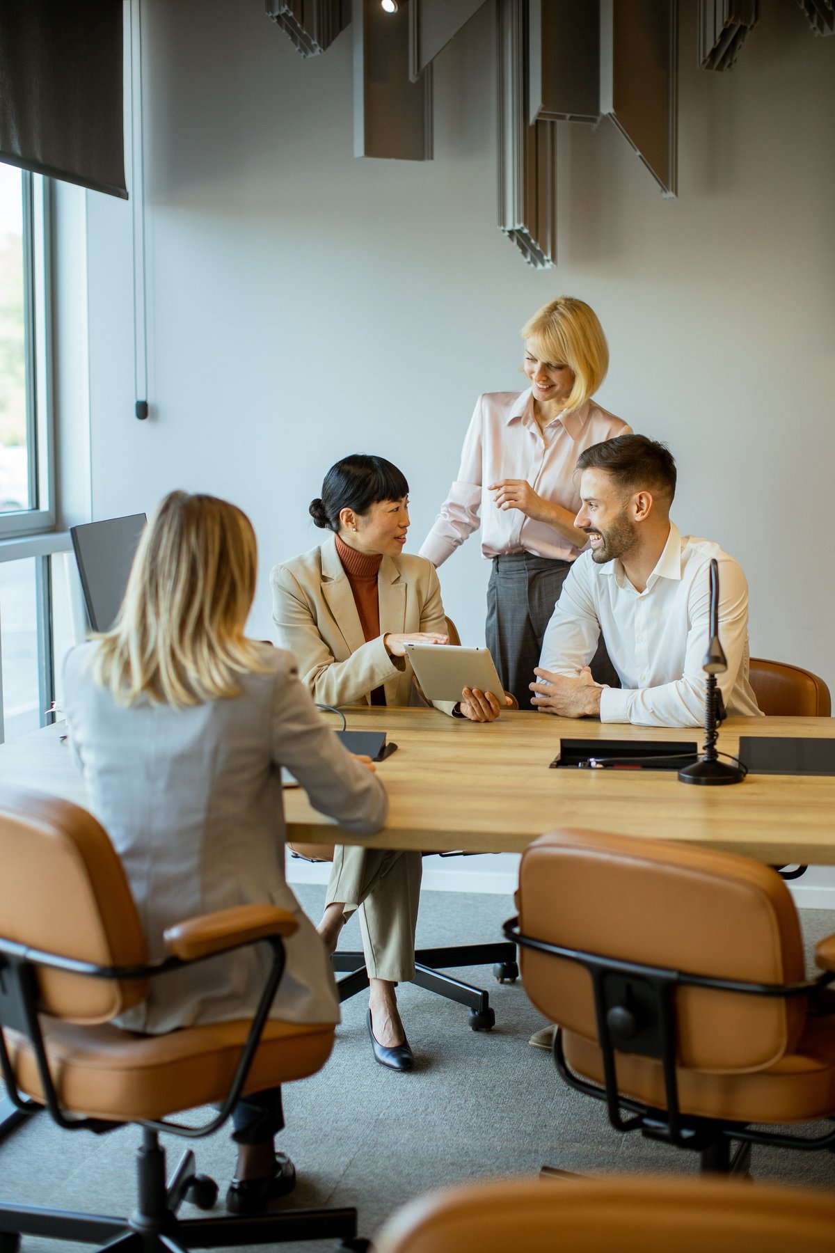 Business team reviewing reporting requirements and dashboard insights