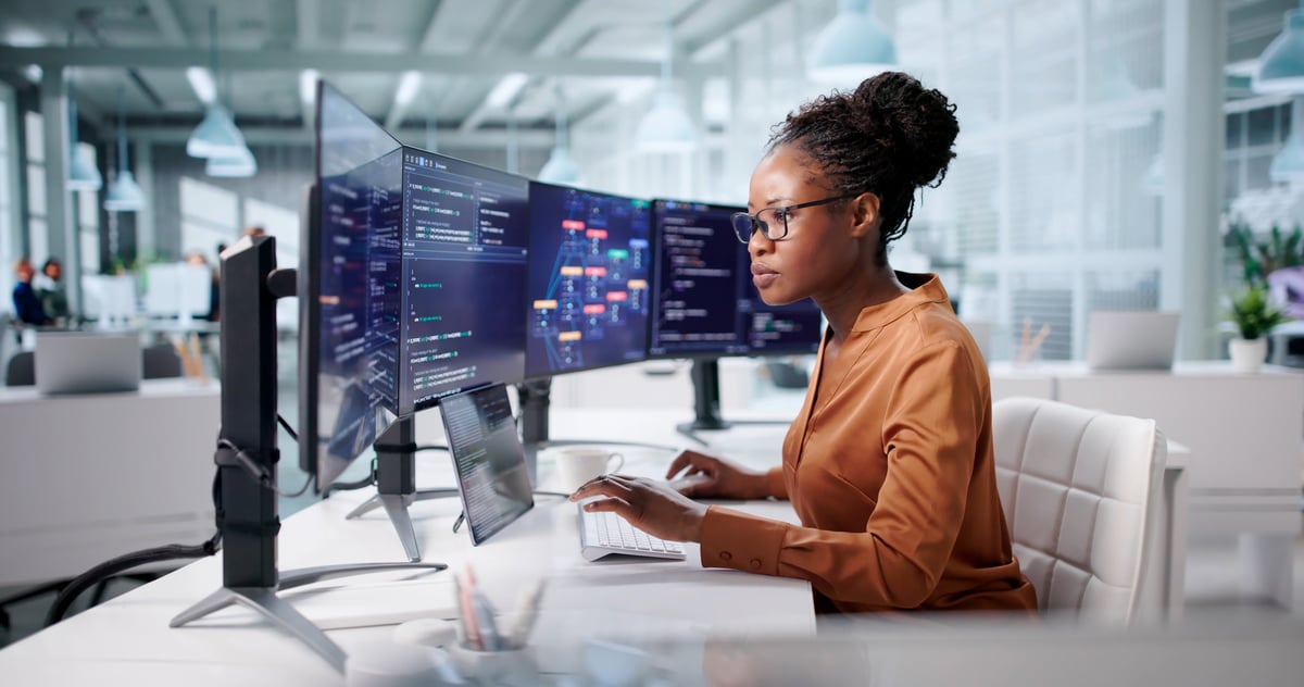 Young woman working on technology skills using a laptop
