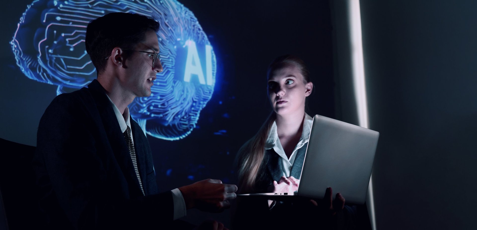 Team collaborating in an AI-powered workspace with digital brain and neural network visuals, representing AI-first business transformation