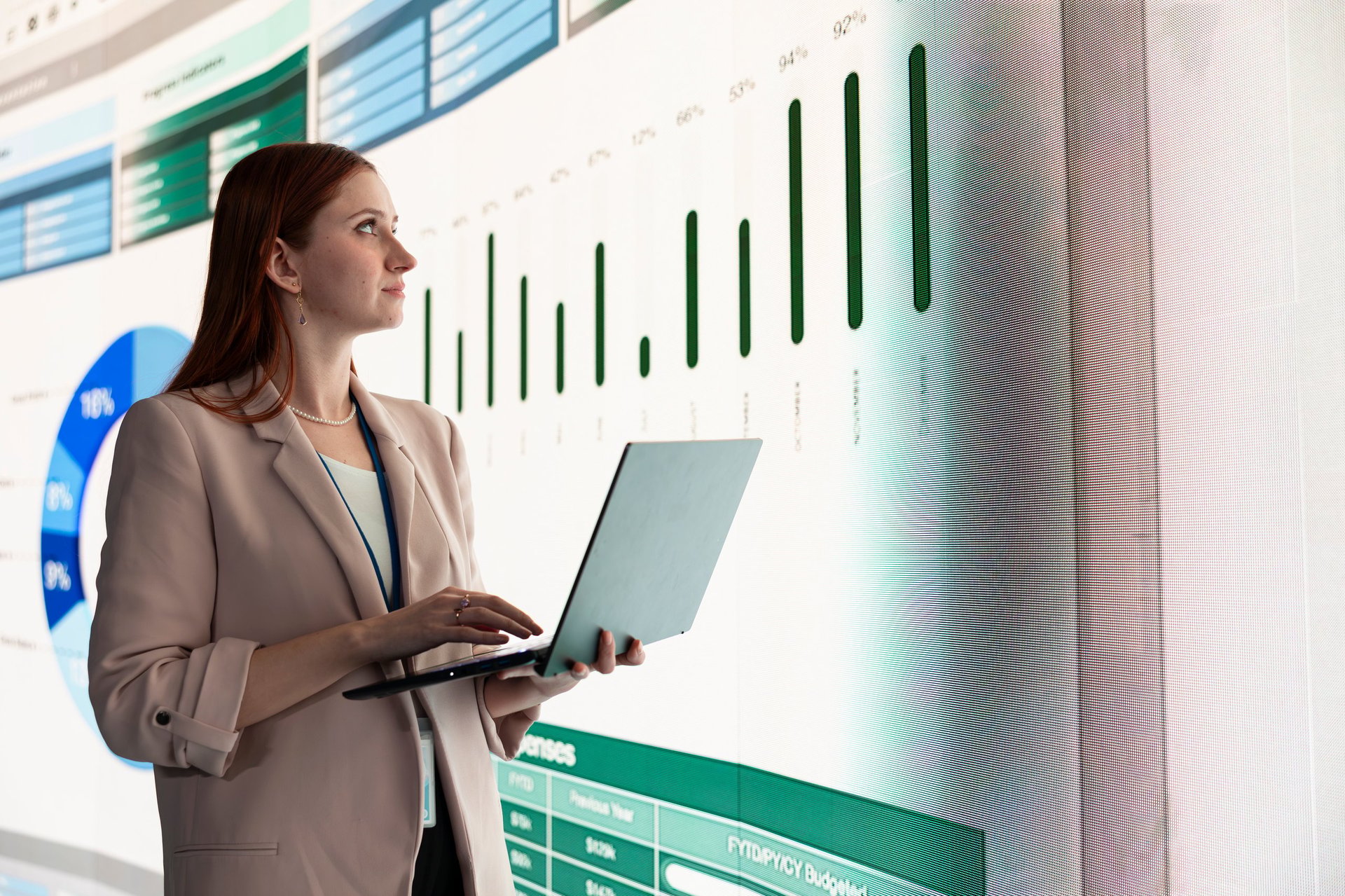 Compiling portfolio report, laptop and investment analyst. Analyzing financial data, infographic metrics and businesswoman showing slide deck charts to company shareholders