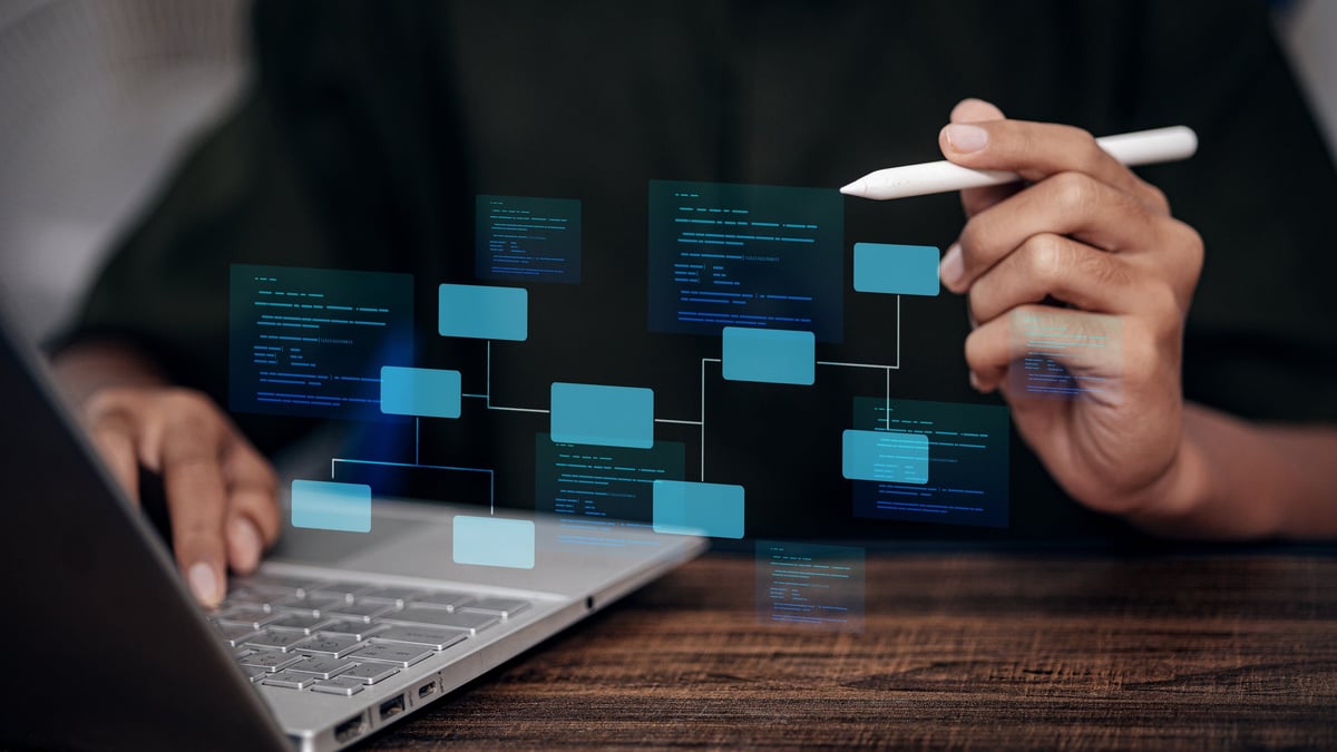 Expert developer using stylus to organize system architecture and flowchart. Concept of software engineering, web development, logic planning, and digital infrastructure design.